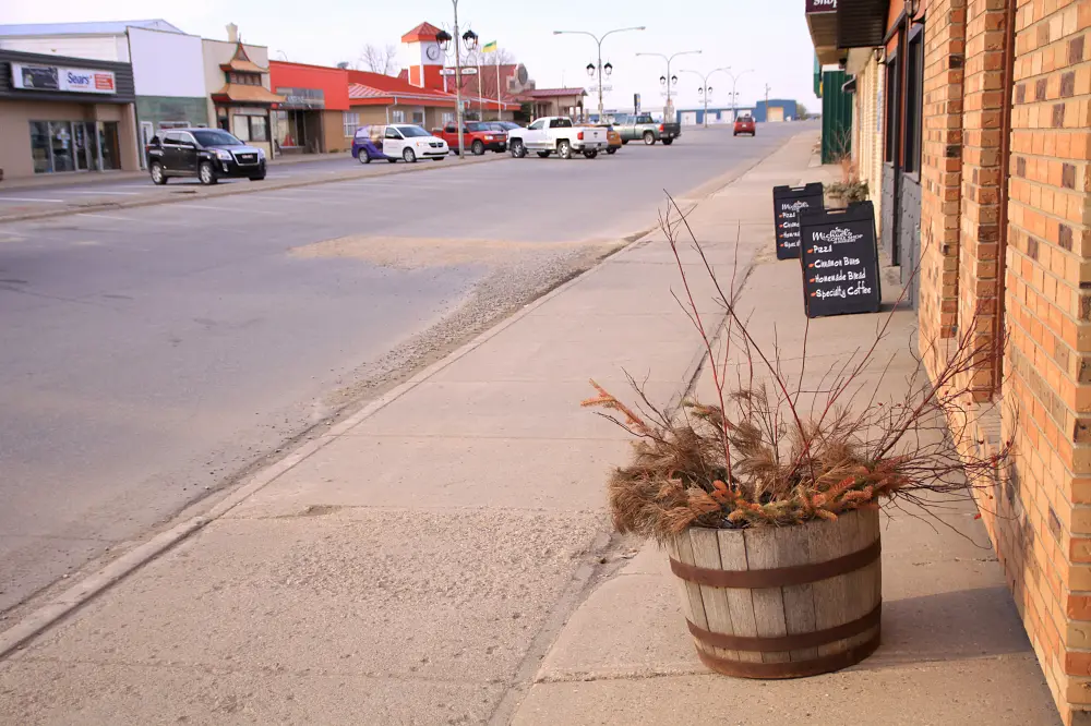 Main Street in Carlyle with barrel planter, 2015