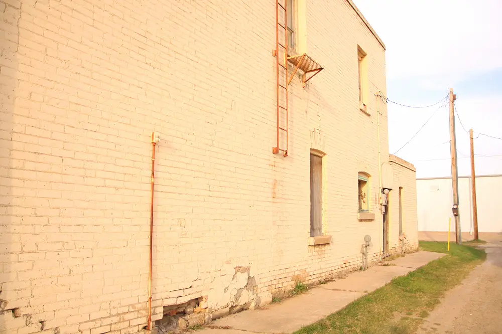 Back alley beside a brick building, 2015