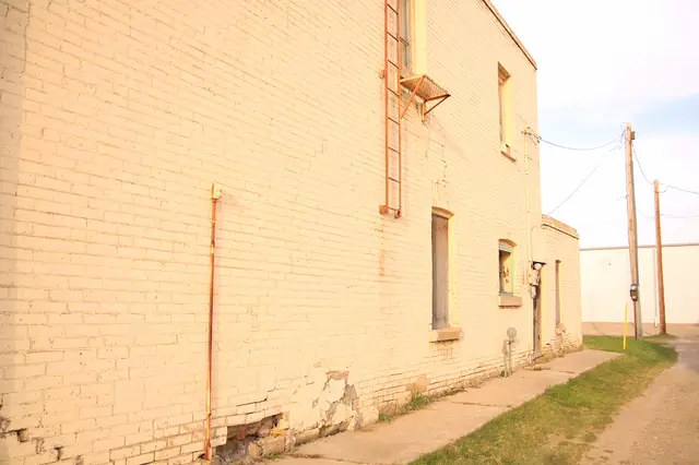 Back alley beside a brick building